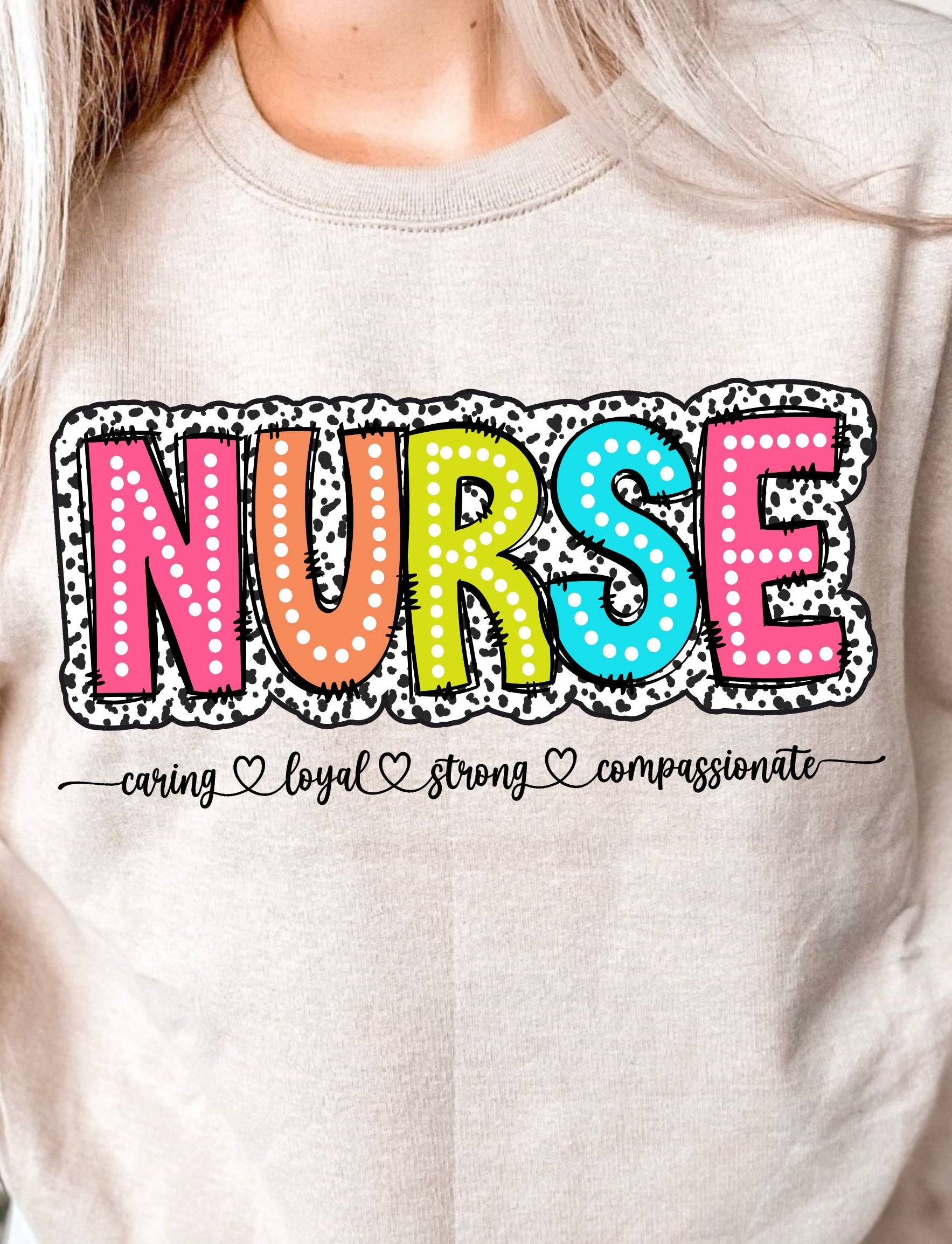 DTF shirt transfer with the word NURSE in dalmatian and polka dot patterns with caring loyal strong compassionate script below